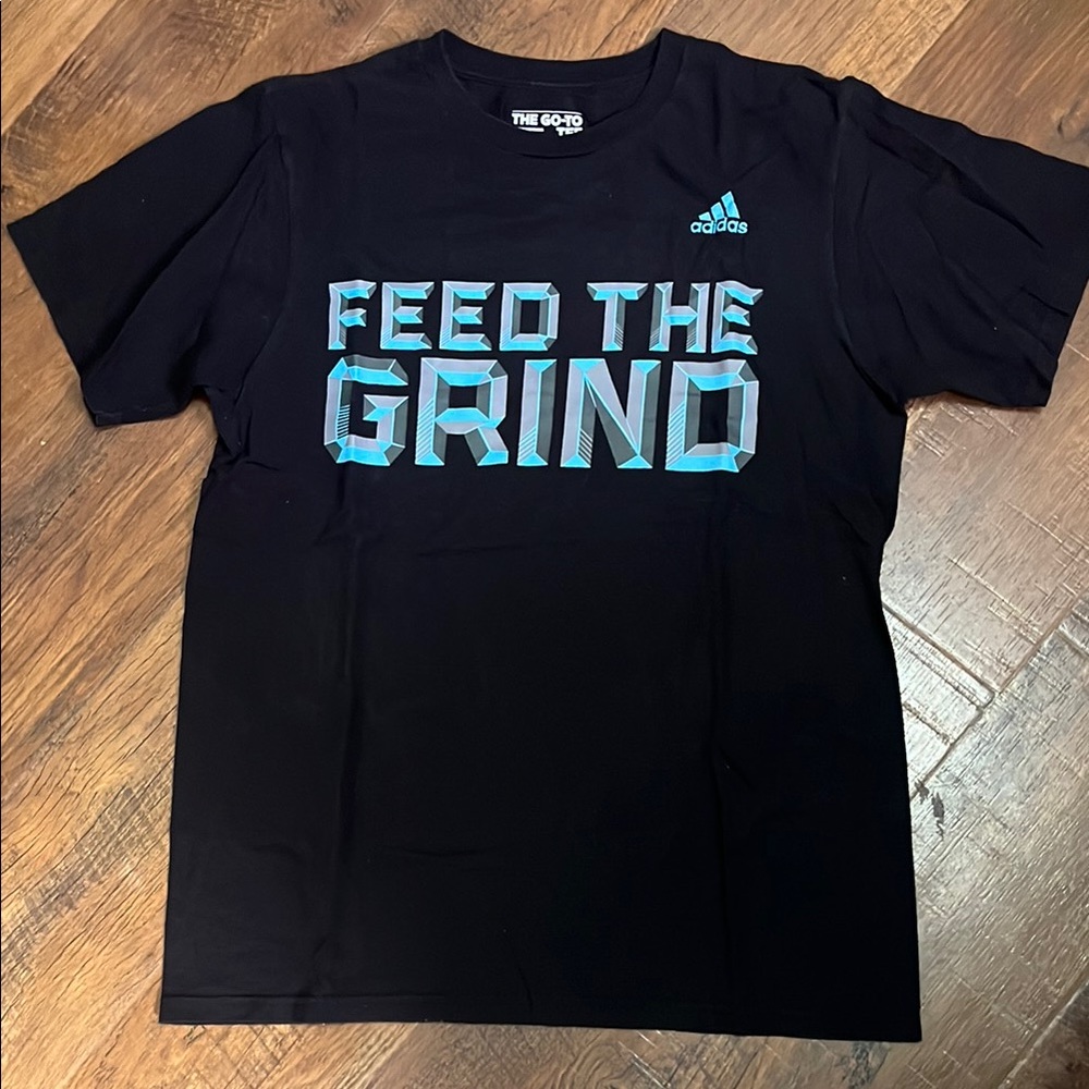 Adidas Black The Go To Tee with Blue Graphic Feed the Grind